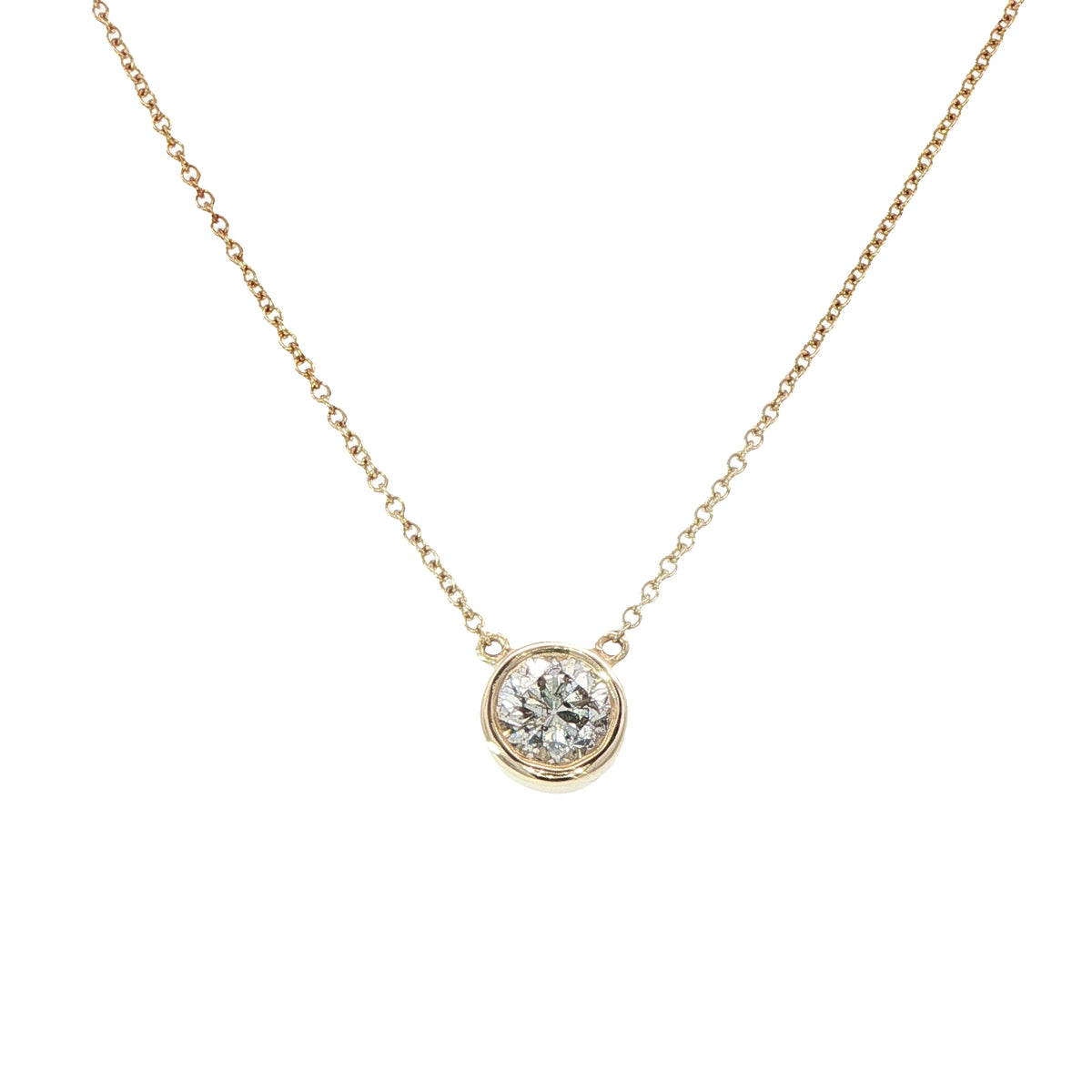 9 Carat Yellow Gold and Diamond Rim Set Pendant. 0.50 cts
