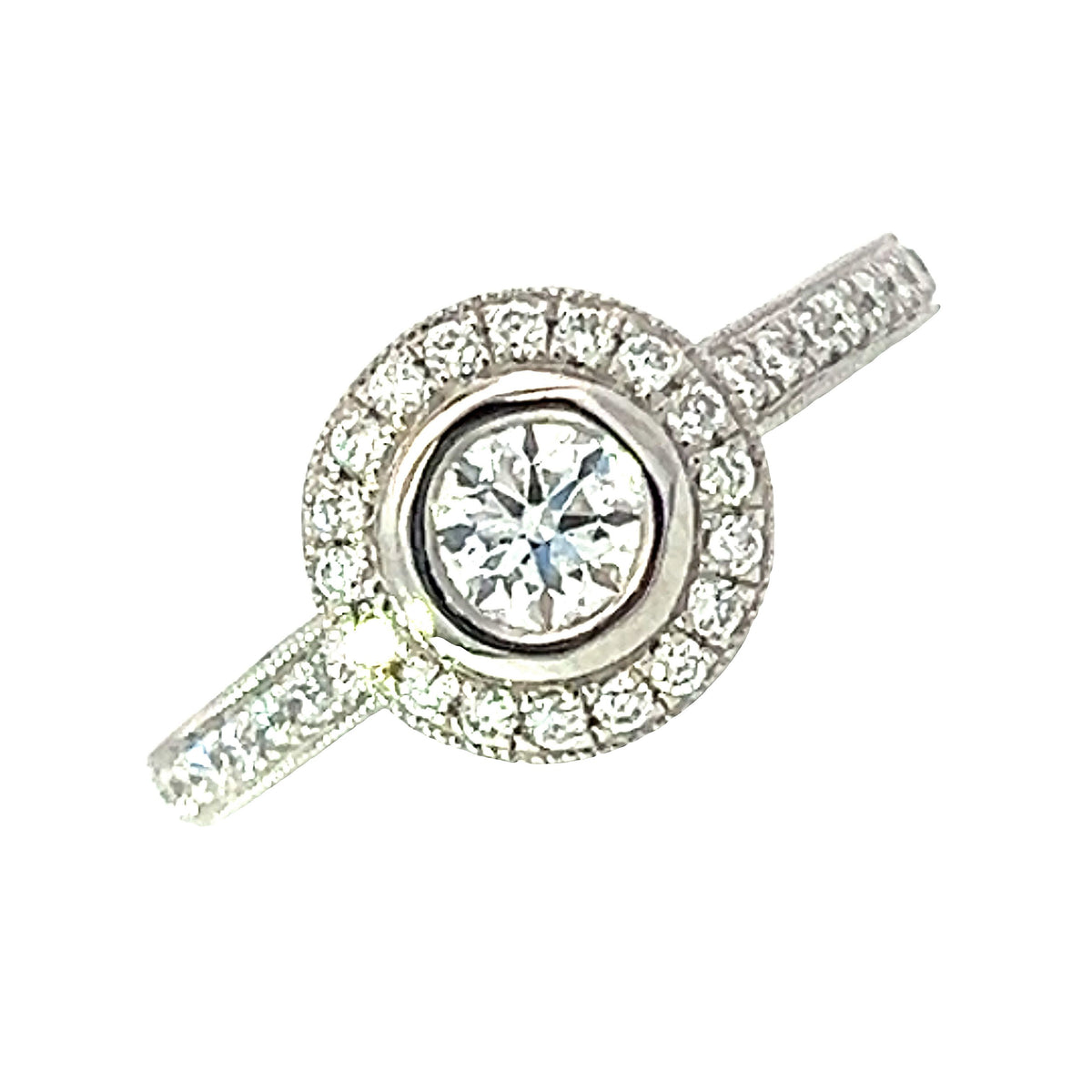 A Platinum and Diamond Vintage Style Halo Ring - 0.34 F VS2