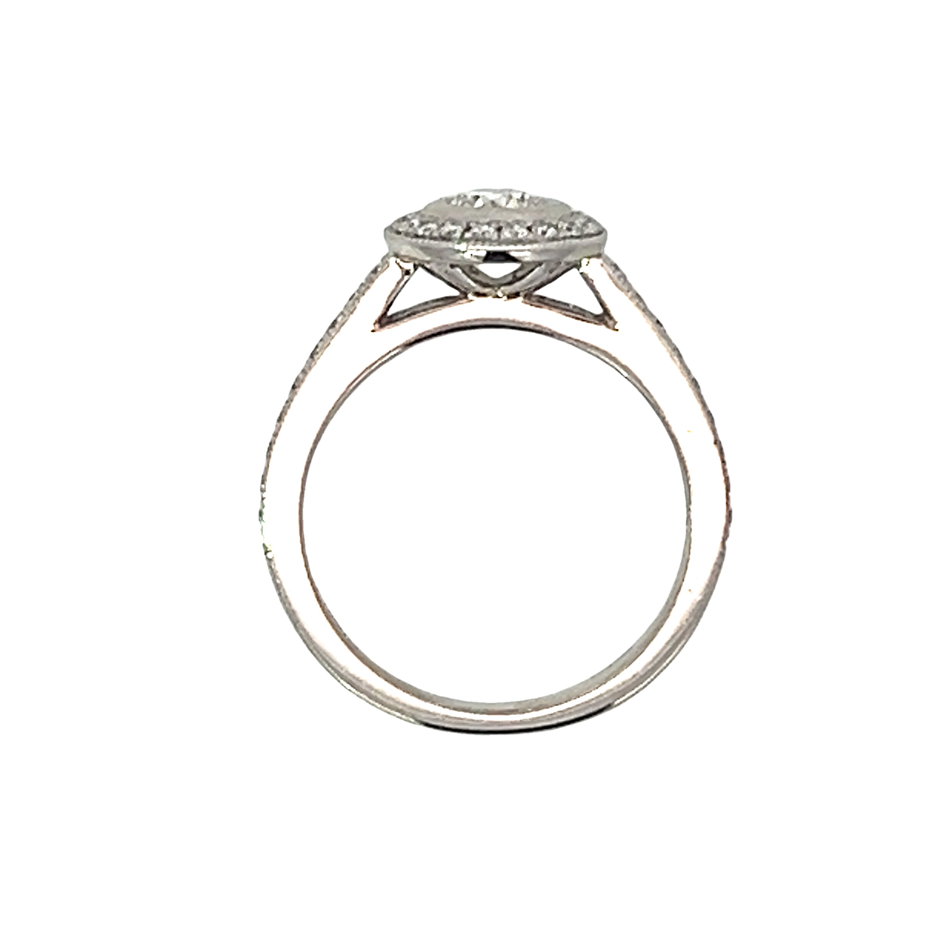 A Platinum and Diamond Vintage Style Halo Ring - 0.6 D VS2