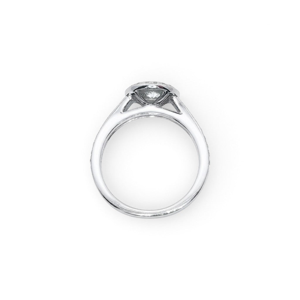 A Platinum and Diamond Vintage Style Halo Ring - 0.34 F VS2