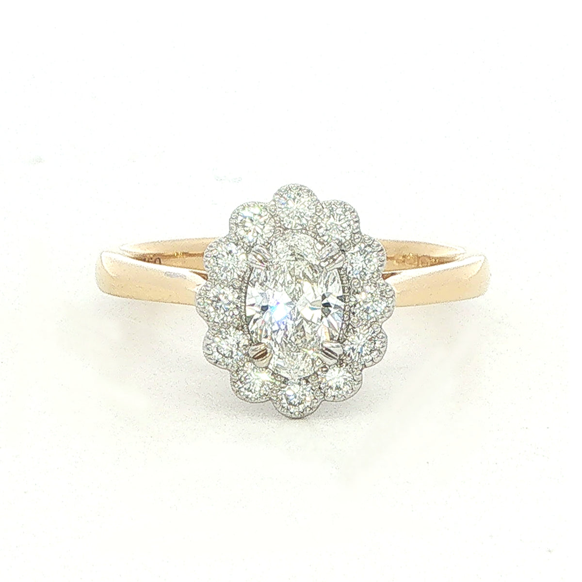 An 18 Carat Yellow and White Gold Oval Diamond Ring