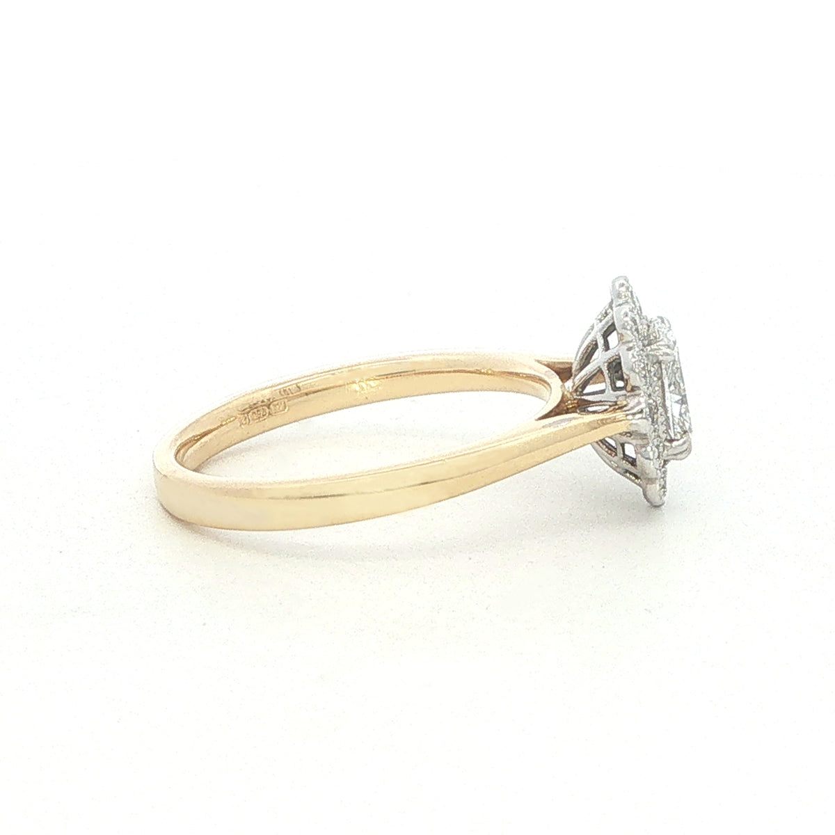 An 18 Carat Yellow and White Gold Oval Diamond Ring