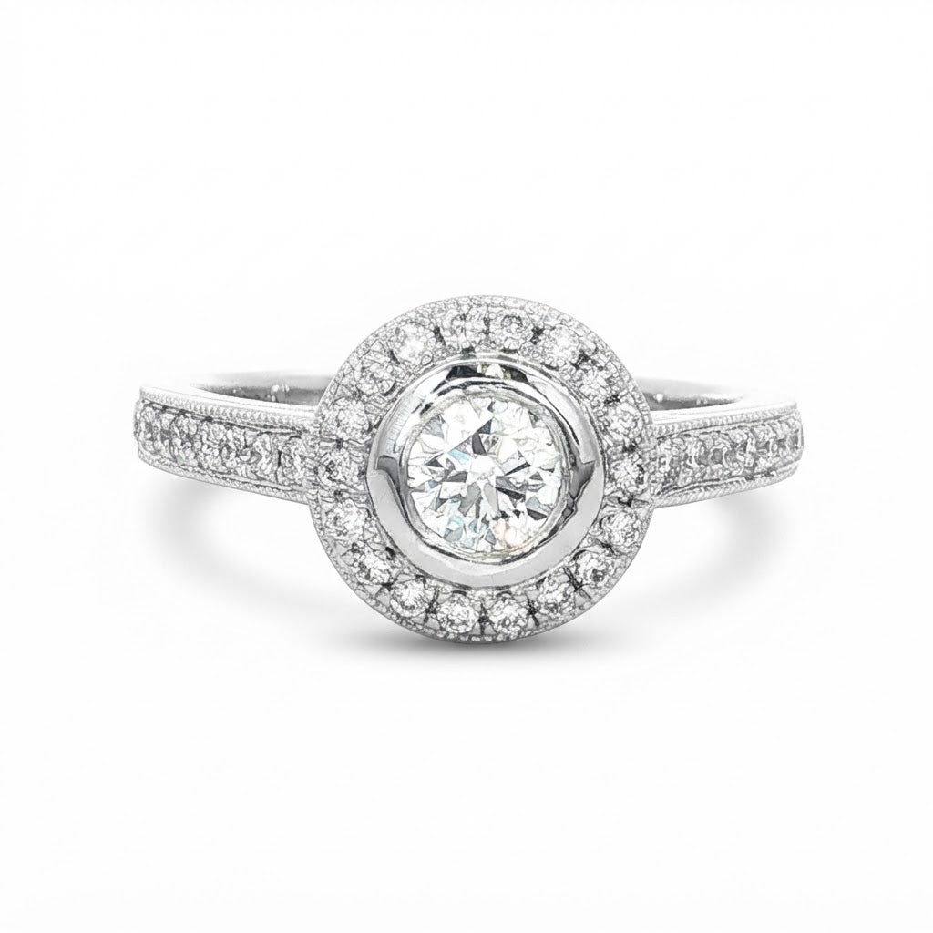 A Platinum and Diamond Vintage Style Halo Ring - 0.34 F VS2