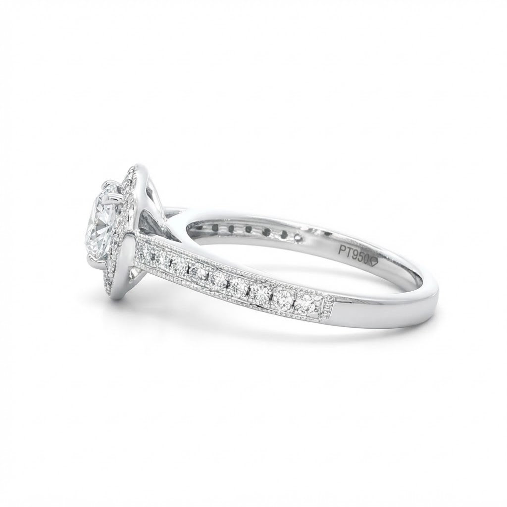 A Platinum and Diamond Vintage Style Halo Ring - 0.34 F VS2