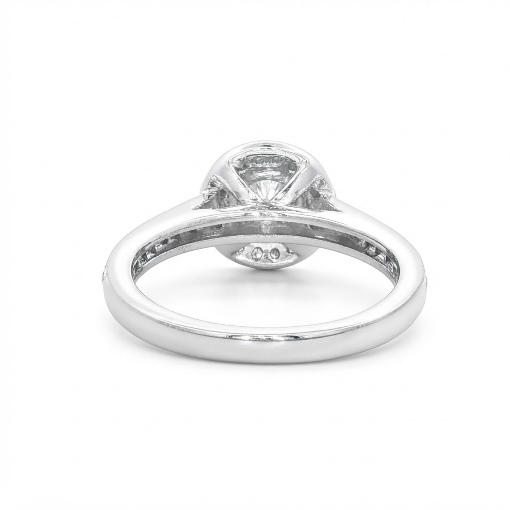 A Platinum and Diamond Vintage Style Halo Ring - 0.34 F VS2