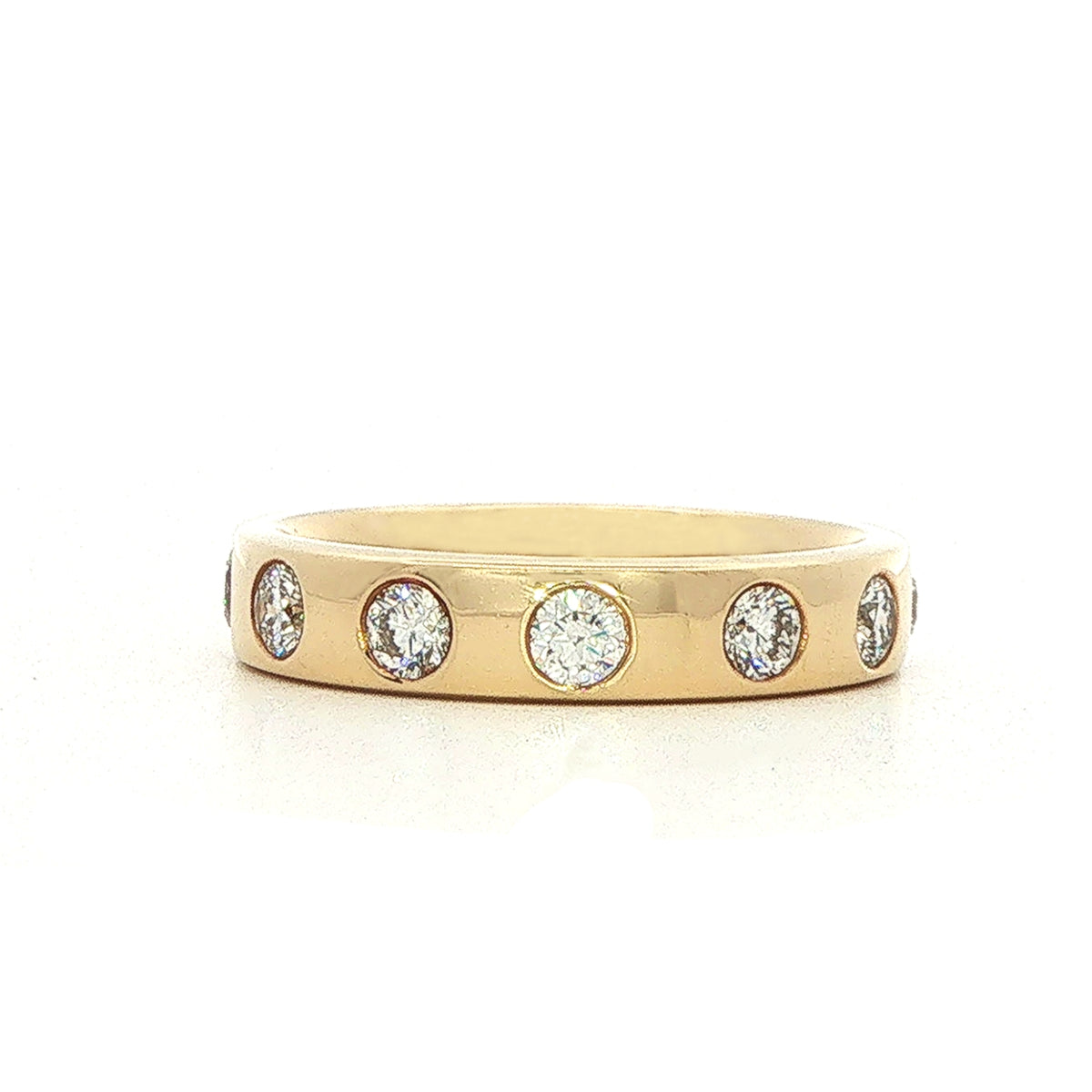 An 18 Carat Yellow Gold and Diamond Flush Set Eternity Style Ba