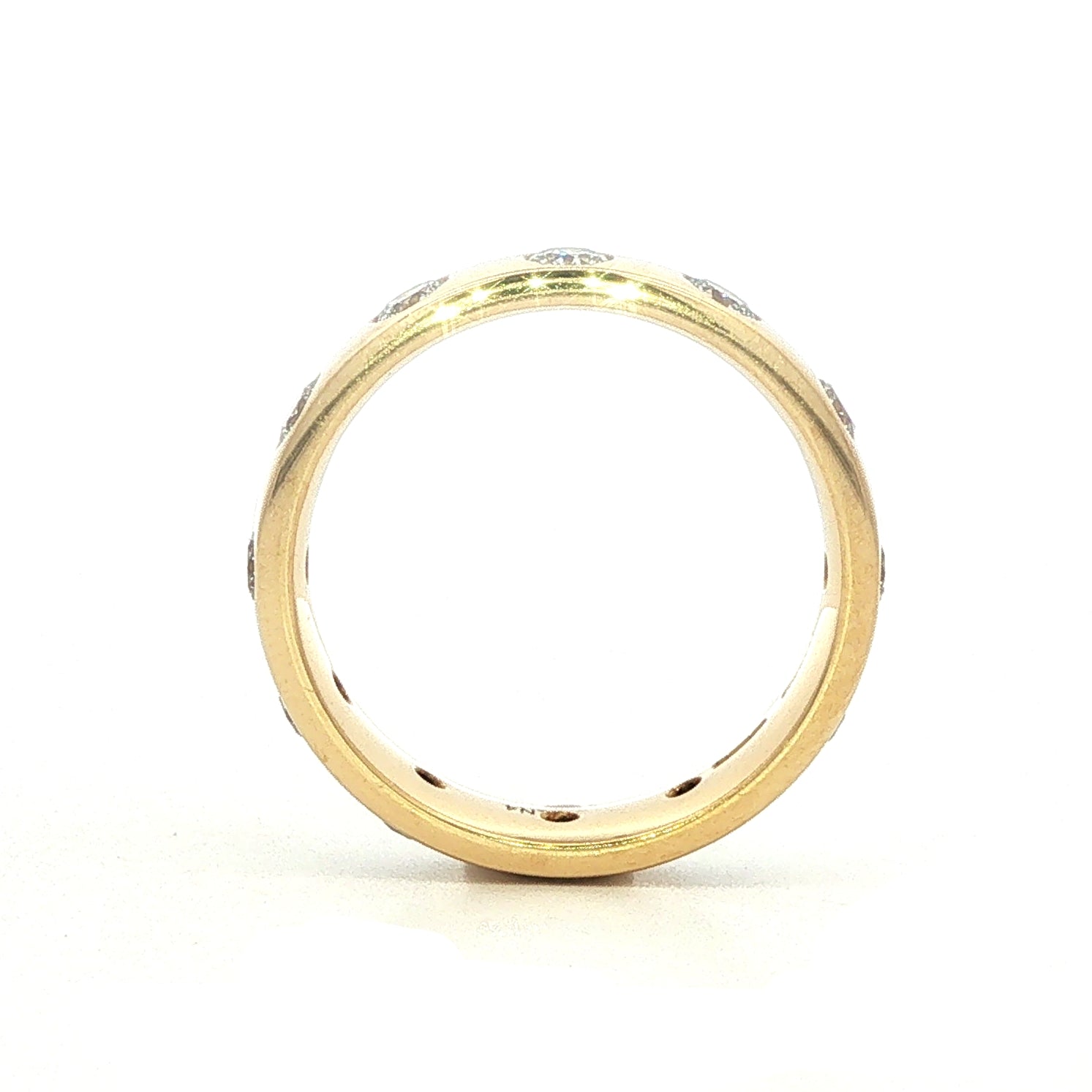An 18 Carat Yellow Gold and Diamond Flush Set Eternity Style Ba
