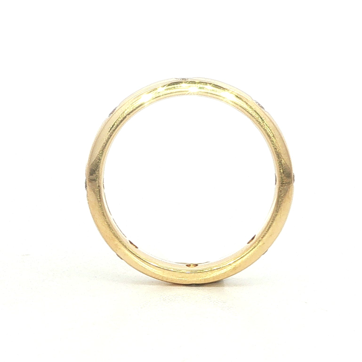 A 18 Carat Yellow and Diamond Flush Set Eternity Style Band