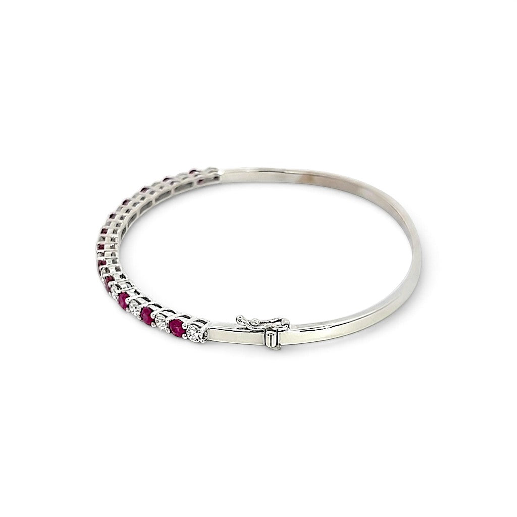 An 18 Carat White Gold Ruby and Diamond Hinge Bangle