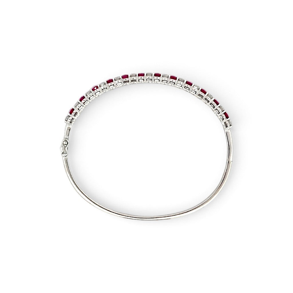 An 18 Carat White Gold Ruby and Diamond Hinge Bangle