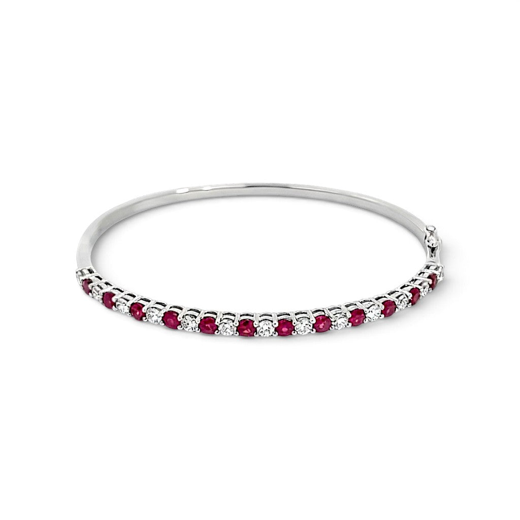 An 18 Carat White Gold Ruby and Diamond Hinge Bangle
