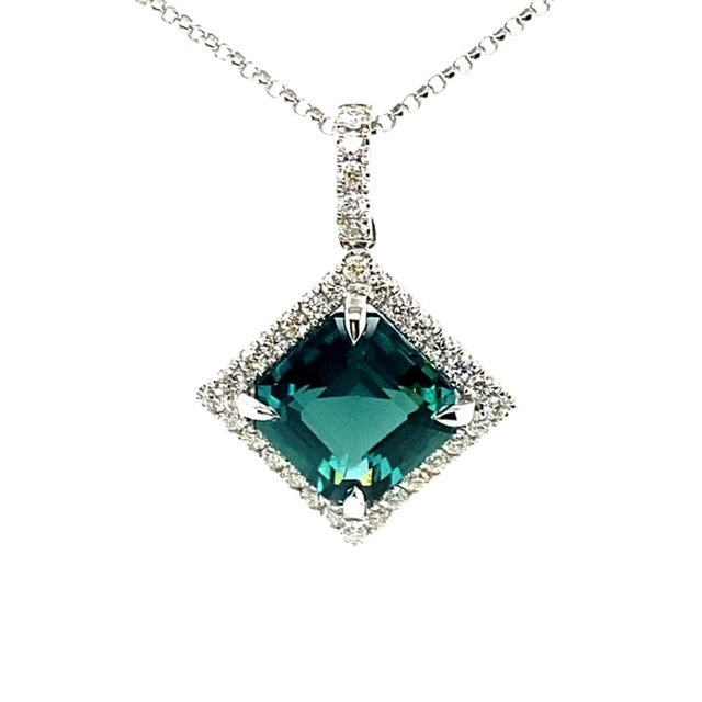 An 18 Carat White Gold Tourmaline and Diamond Halo Pendant