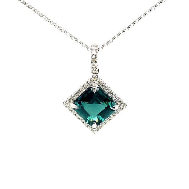 An 18 Carat White Gold Tourmaline and Diamond Halo Pendant