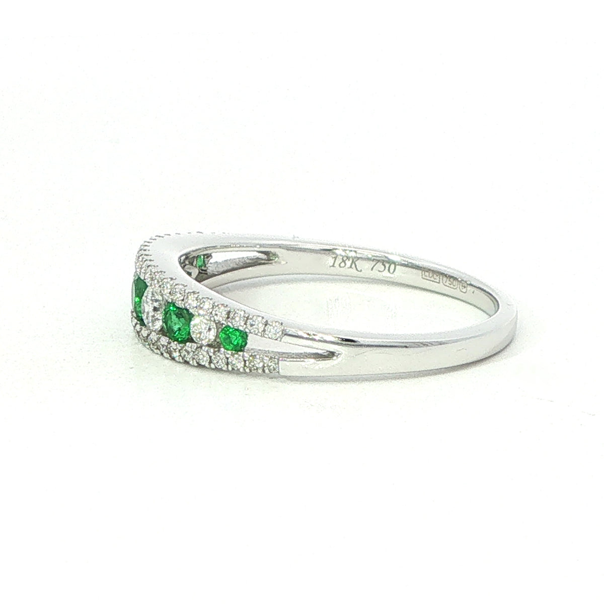 An 18 Carat White Gold Emerald and Diamond Ring