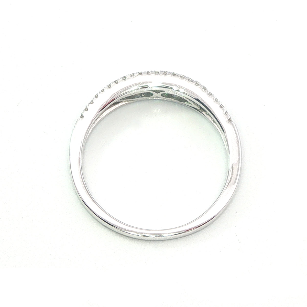 An 18 Carat White Gold Emerald and Diamond Ring