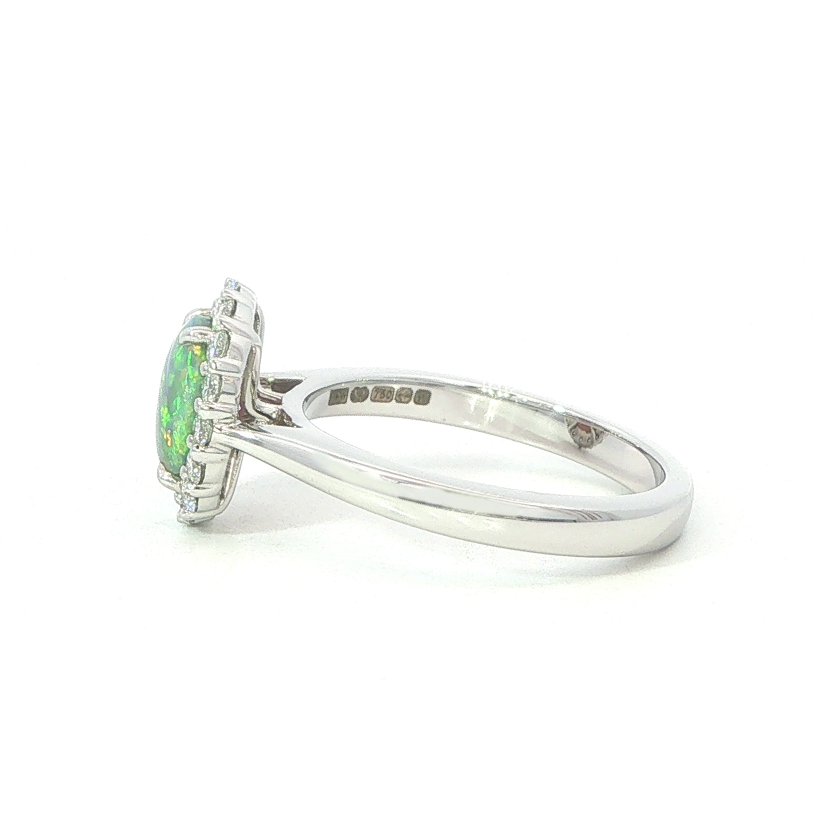 An 18 Carat White Gold Black Opal and Diamond Halo Ring