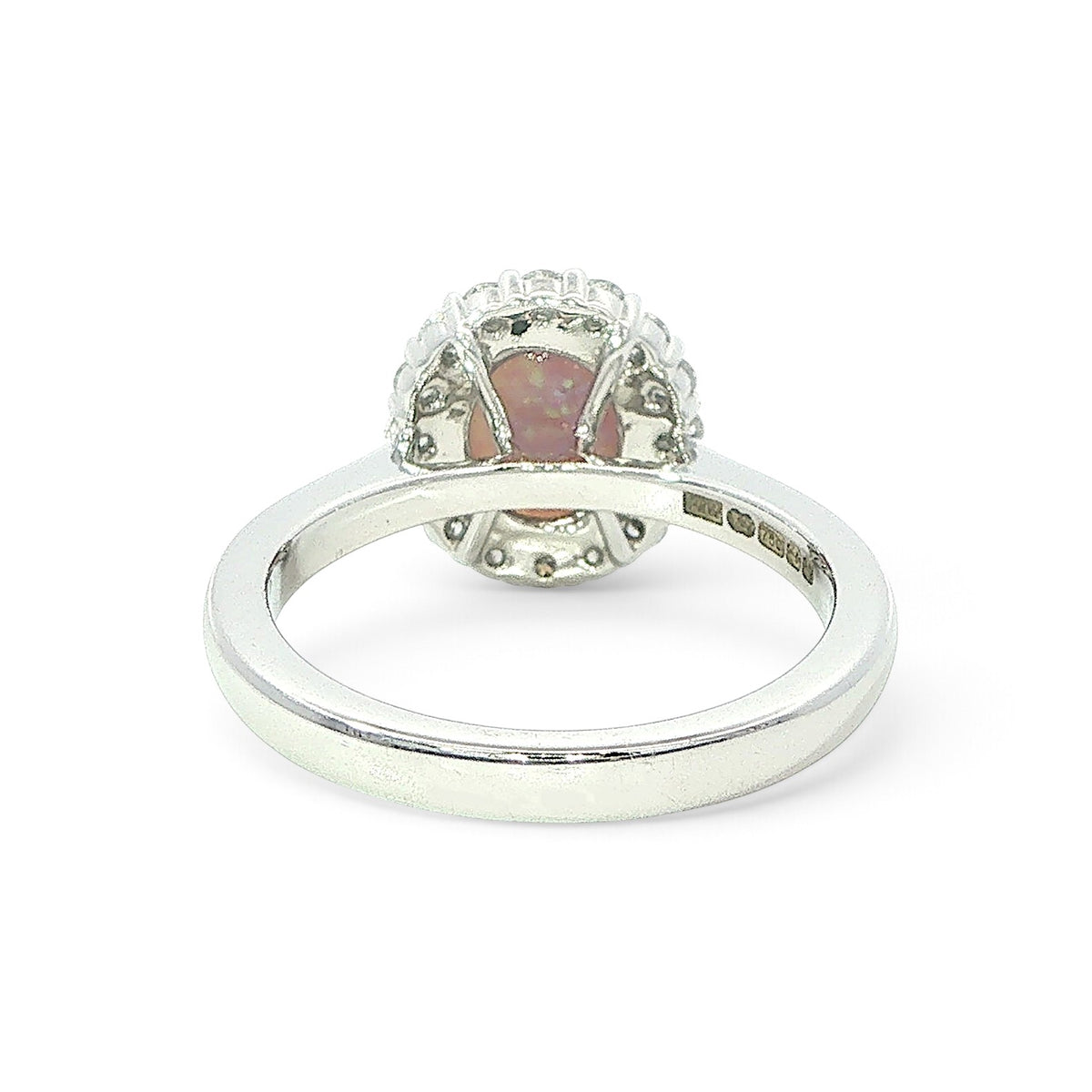An 18 Carat White Gold Black Opal and Diamond Halo Ring