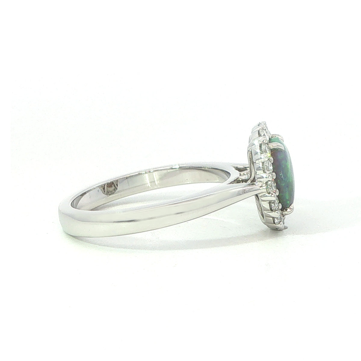 An 18 Carat White Gold Black Opal and Diamond Halo Ring