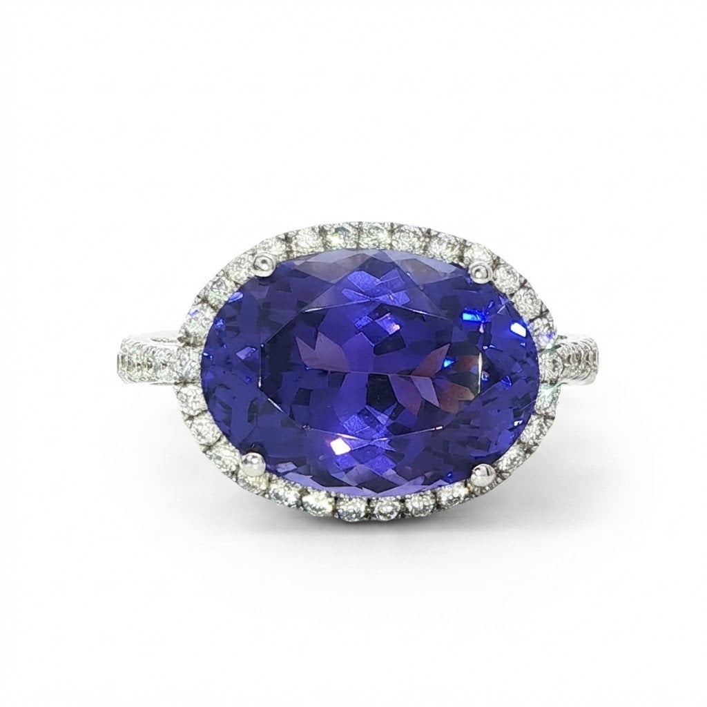 AN 18 Carat White Gold Tanzanite and Diamond Halo Cocktail Ring