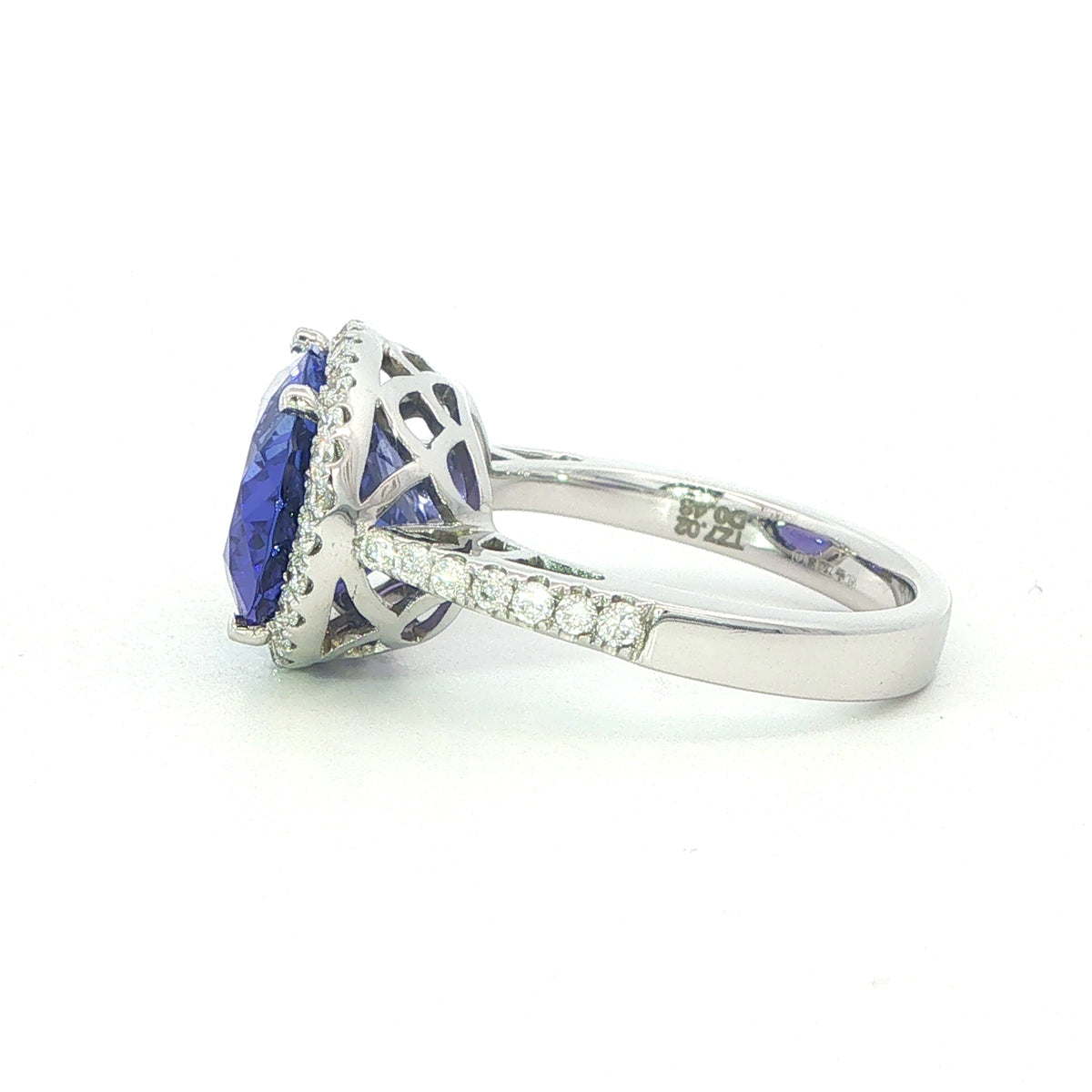 AN 18 Carat White Gold Tanzanite and Diamond Halo Cocktail Ring
