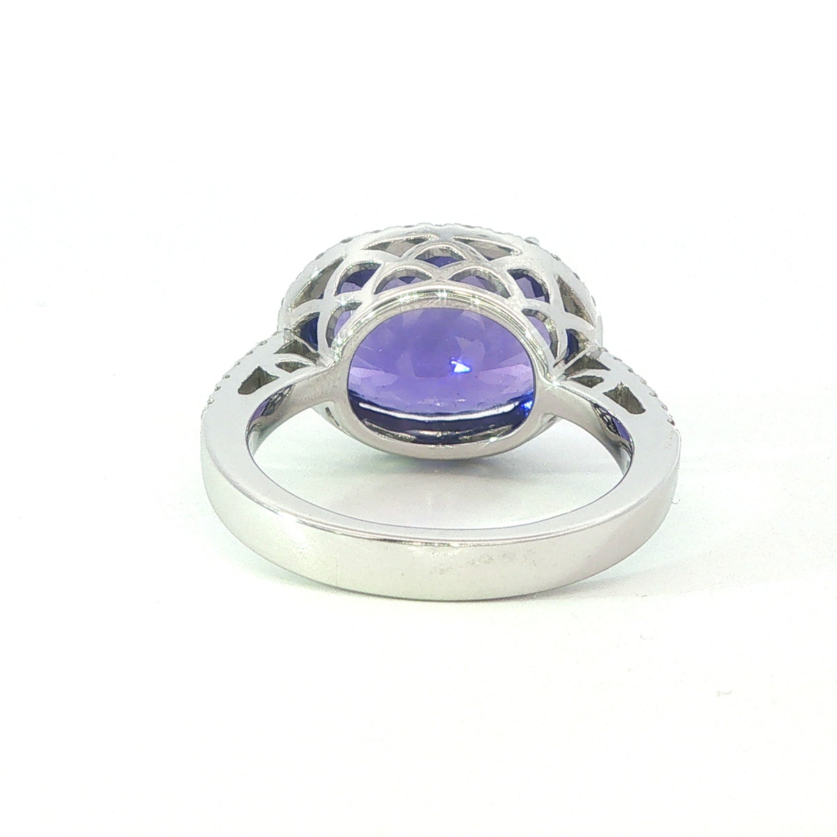 AN 18 Carat White Gold Tanzanite and Diamond Halo Cocktail Ring