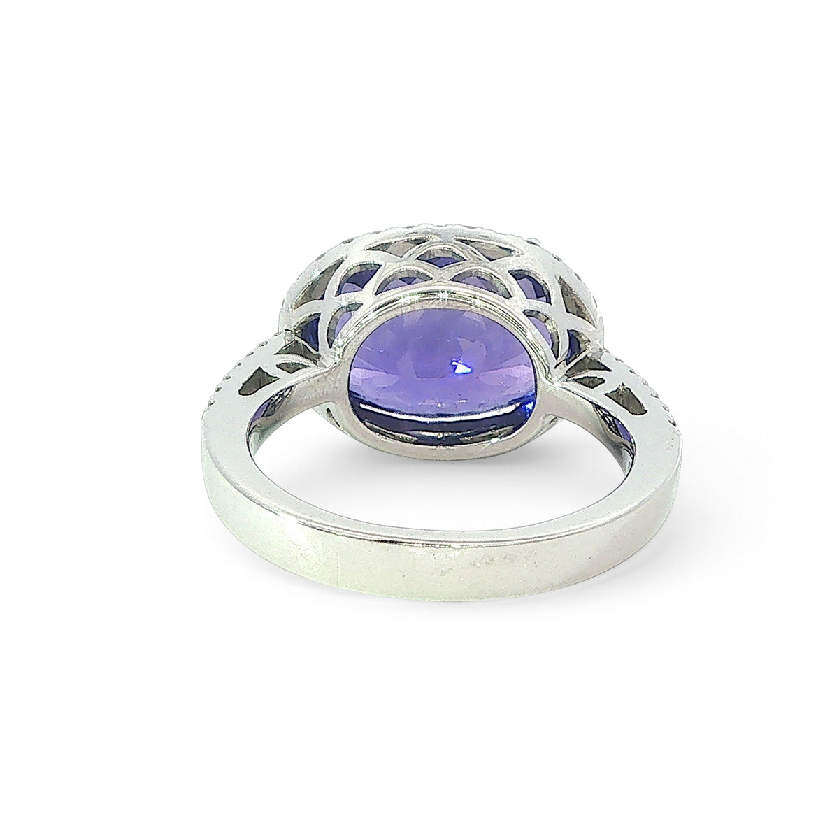 An 18 Carat White Gold Tanzanite and Diamond Halo Cocktail Ring