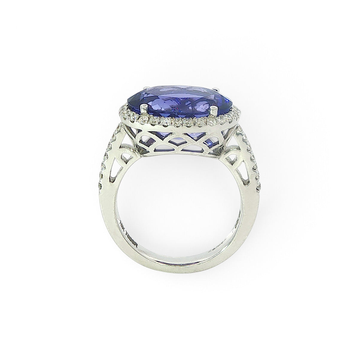 An 18 Carat White Gold Tanzanite and Diamond Halo Cocktail Ring
