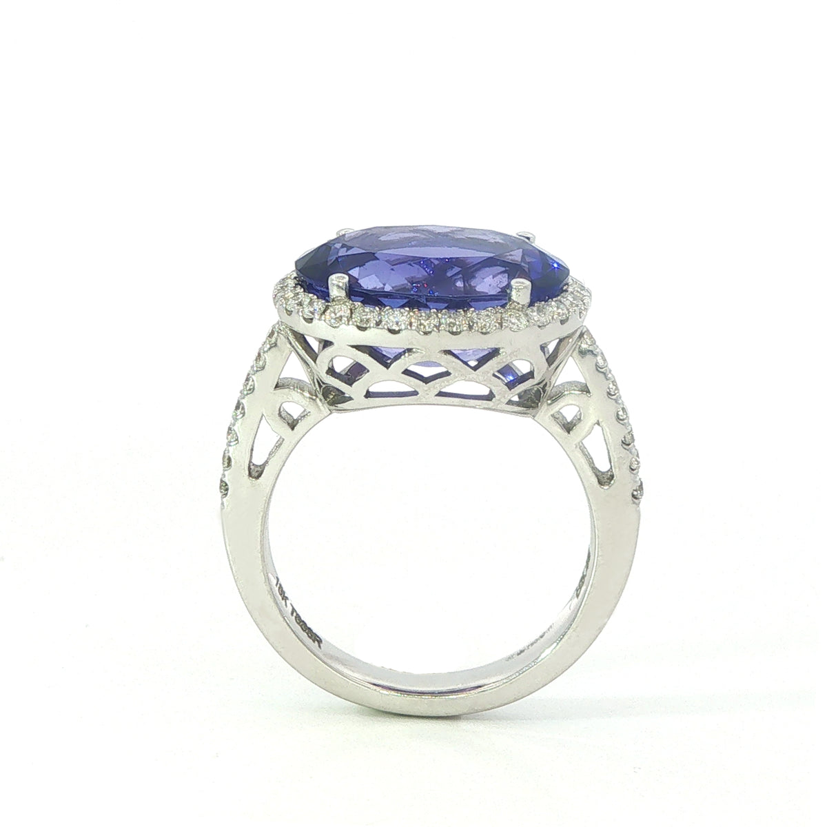 AN 18 Carat White Gold Tanzanite and Diamond Halo Cocktail Ring