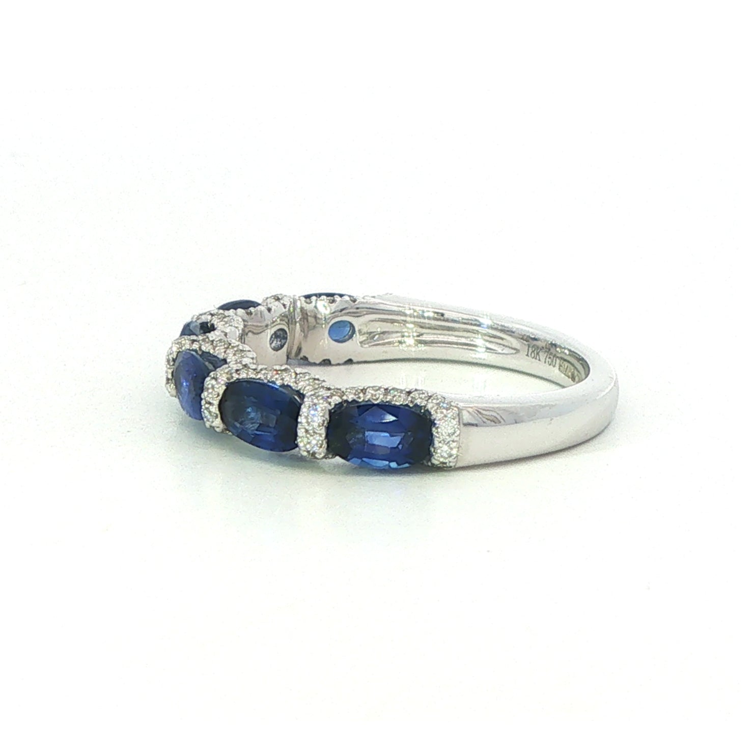 An 18 Carat White Gold Sapphire and Diamond 6 Stone Ring