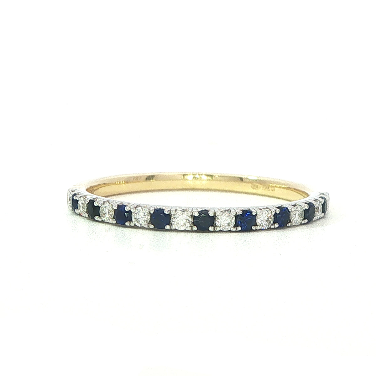 A 18 Carat Yellow and White Gold Sapphire and Diamond Half Eternity Style Ring