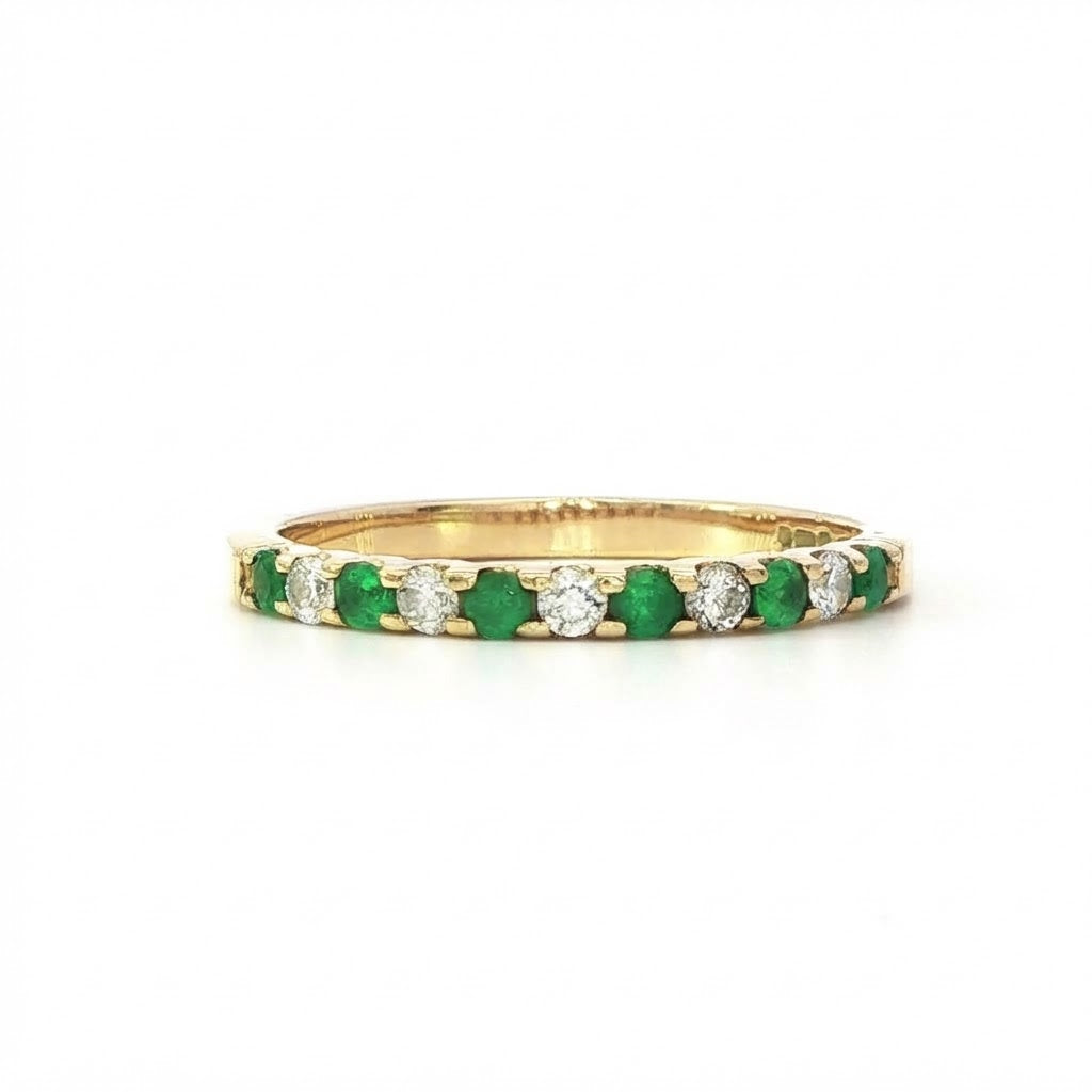 An 18 Carat Yellow Gold Emerald and Diamond Cog Set ½ Eternity Ring