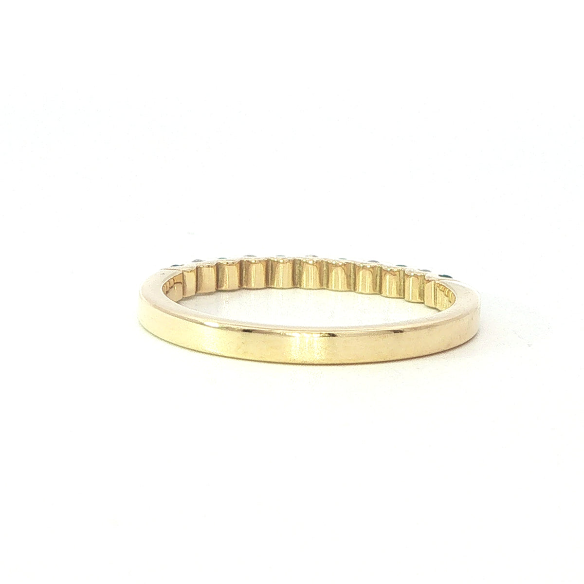 An 18 Carat Yellow Gold Emerald and Diamond Cog Set ½ Eternity Ring
