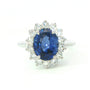 A modern 18 carat white gold Sapphire 2.64 Cts and diamond 0.42 Cts cluster ring.