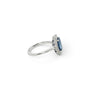 A modern 18 carat white gold Sapphire 2.64 Cts and diamond 0.42 Cts cluster ring.