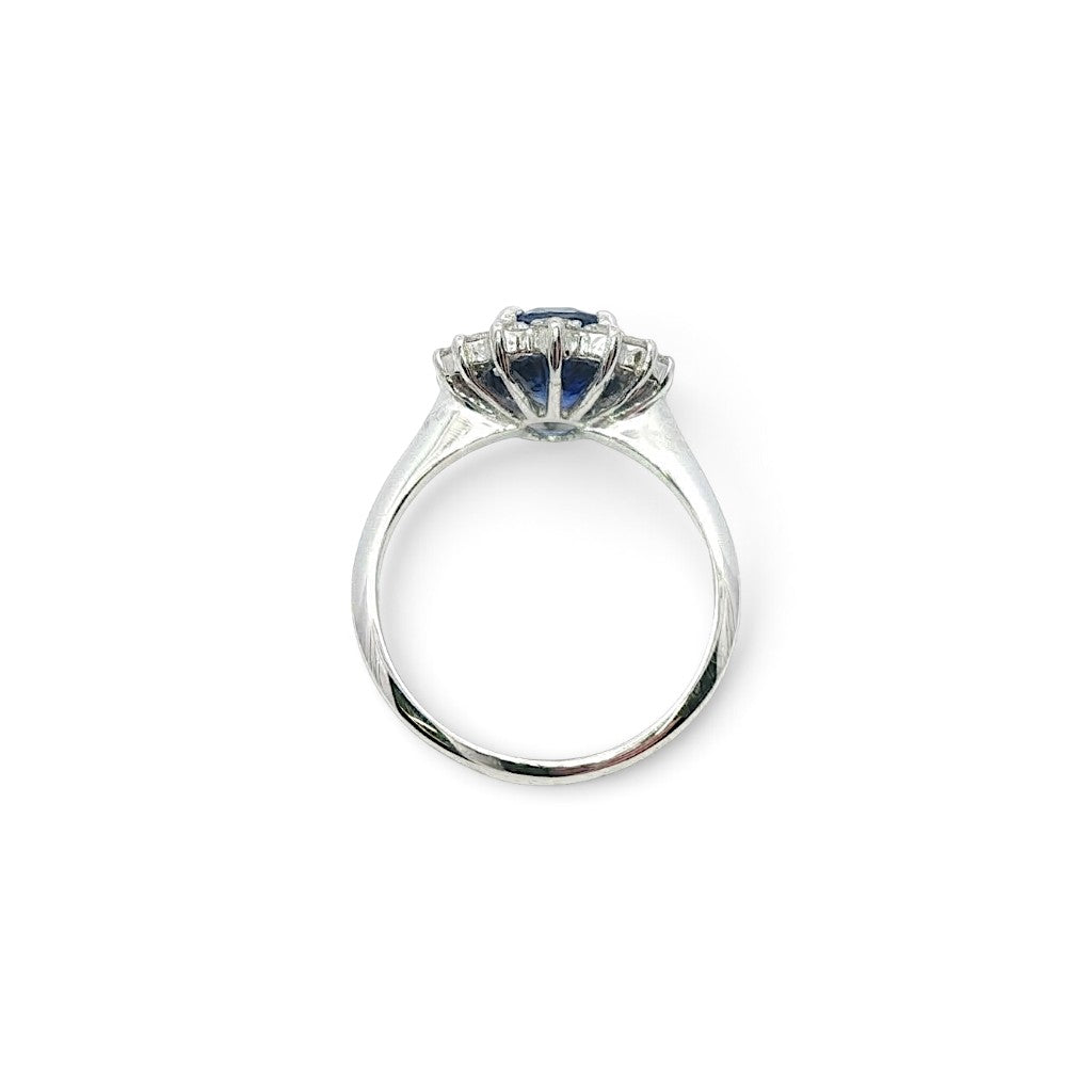 A modern 18 carat white gold Sapphire 2.64 Cts and diamond 0.42 Cts cluster ring.