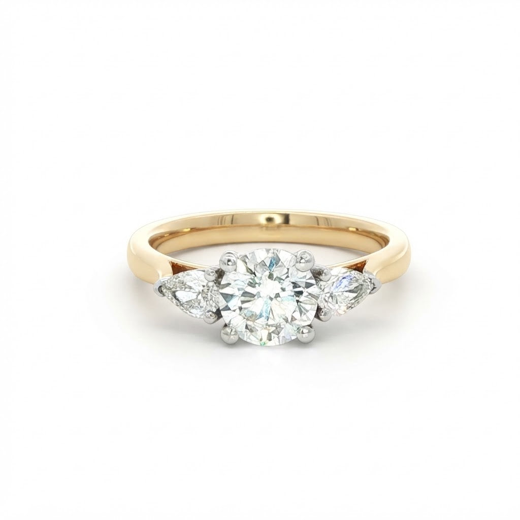 An 18 Carat Yellow Gold Round Brilliant 0.90 D Si1 and Pear Shape Diamond Engagement Ring 1.20 TCW