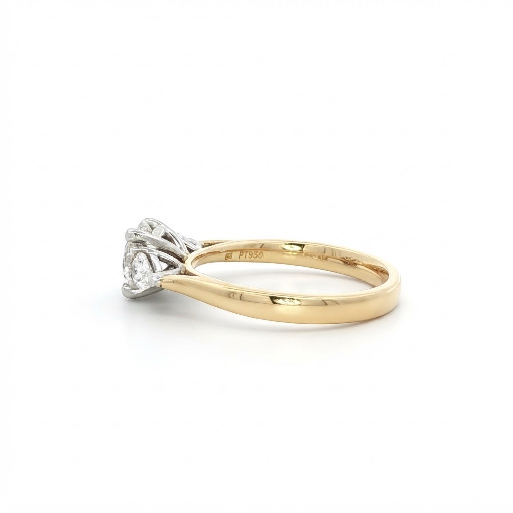 An 18 Carat Yellow Gold Round Brilliant 0.90 D Si1 and Pear Shape Diamond Engagement Ring 1.20 TCW