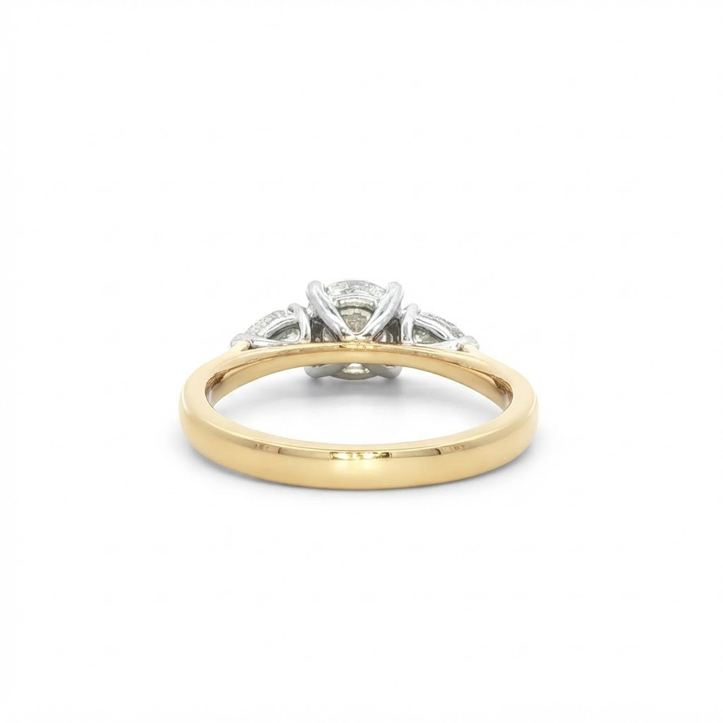 An 18 Carat Yellow Gold Round Brilliant 0.90 D Si1 and Pear Shape Diamond Engagement Ring 1.20 TCW