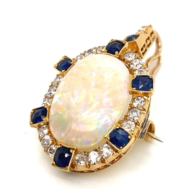 A yellow gold Opal pendant featuring Diamonds and Sapphire