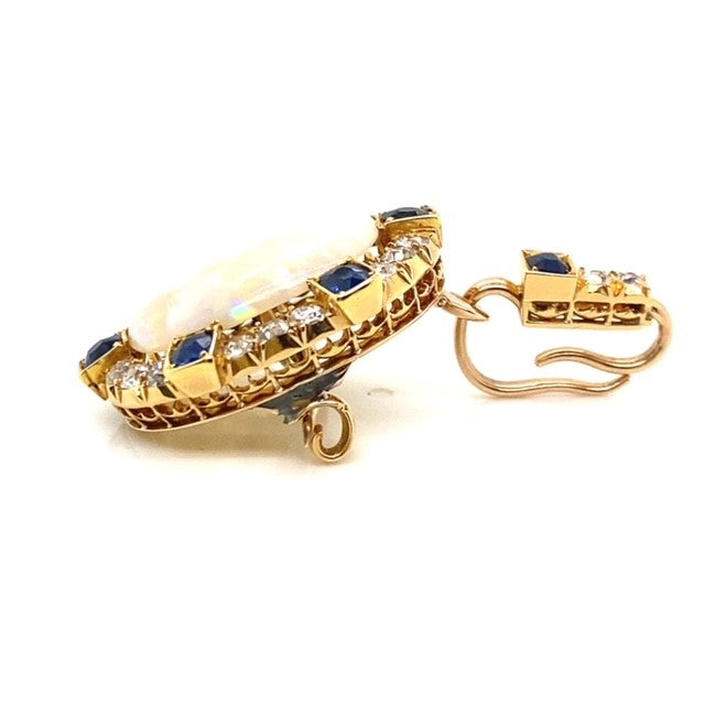 A yellow gold Opal pendant featuring Diamonds and Sapphire