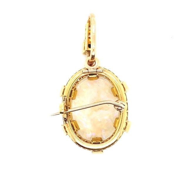 A yellow gold Opal pendant featuring Diamonds and Sapphire