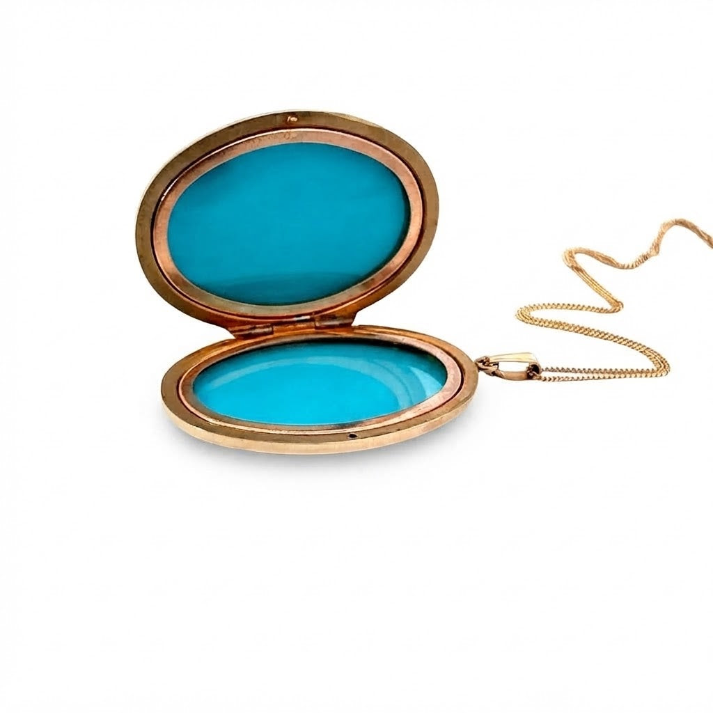 A 9 Carat Gold Engraved Oval Locket