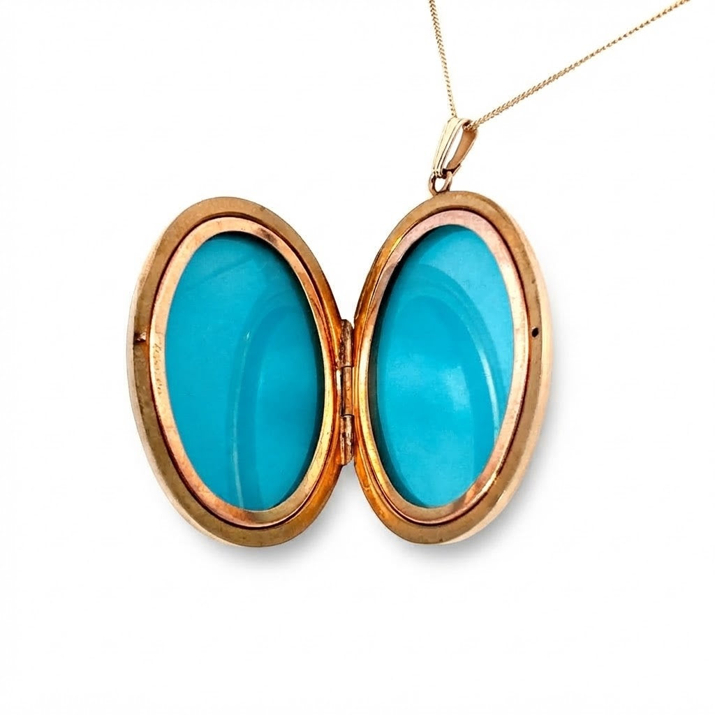 A 9 Carat Gold Engraved Oval Locket