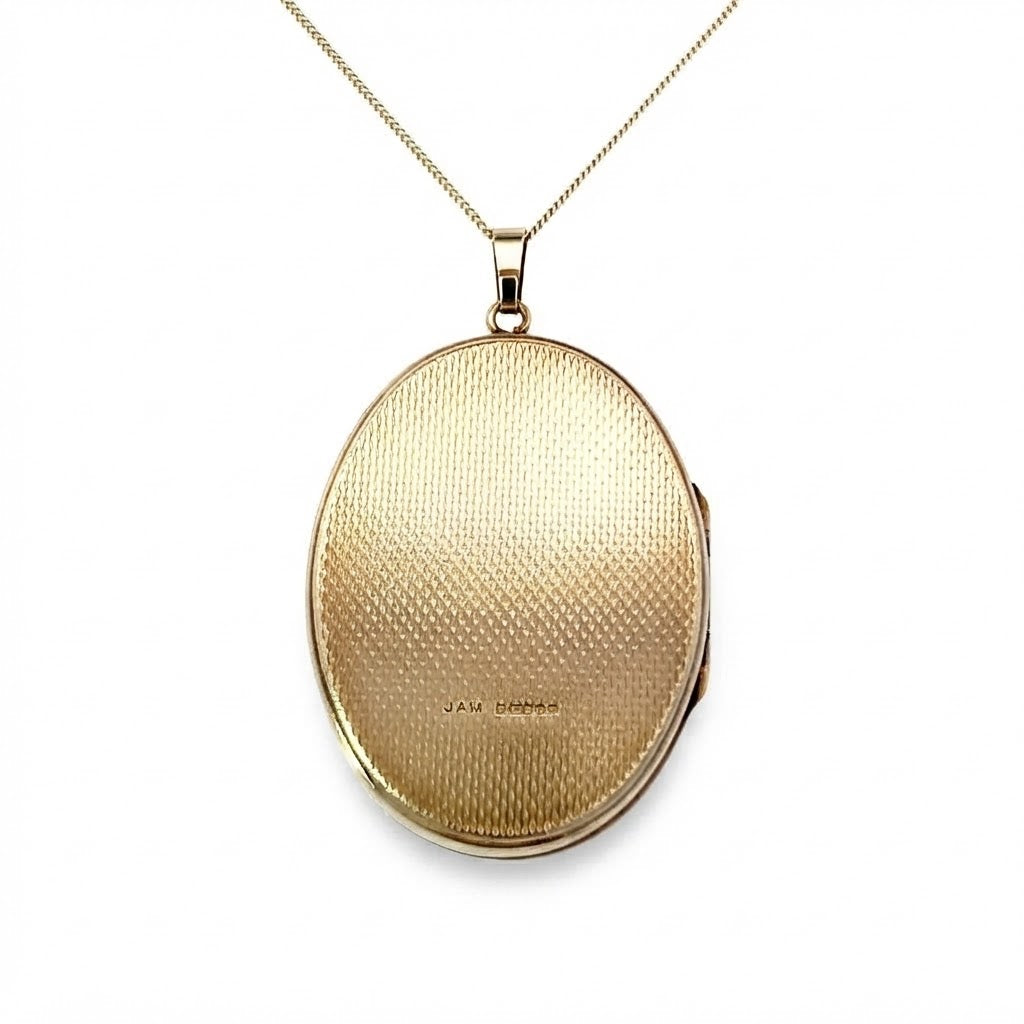 A 9 Carat Gold Engraved Oval Locket
