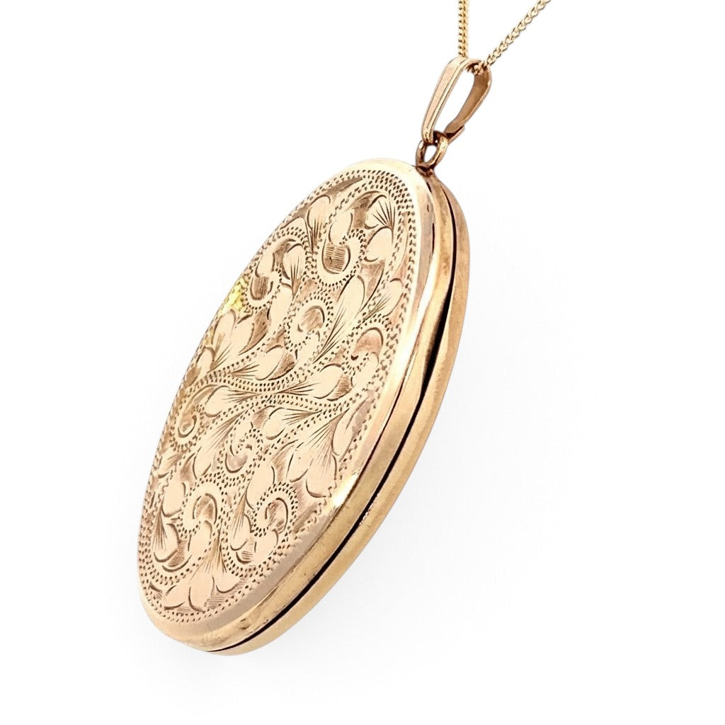 A 9 Carat Gold Engraved Oval Locket
