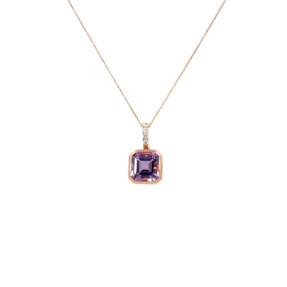 A modern 18 Carat rose gold amethyst and diamond pendant. Featuring a 9mm square step cut natural amethyst in a rose gold rub over settings to an articulated diamond set bail with four (4) natural white modern round brilliant diamonds of G/H colour VS clarity in claw settings. To a 46cm inch rose gold trace chain with an extender loop at 41cms