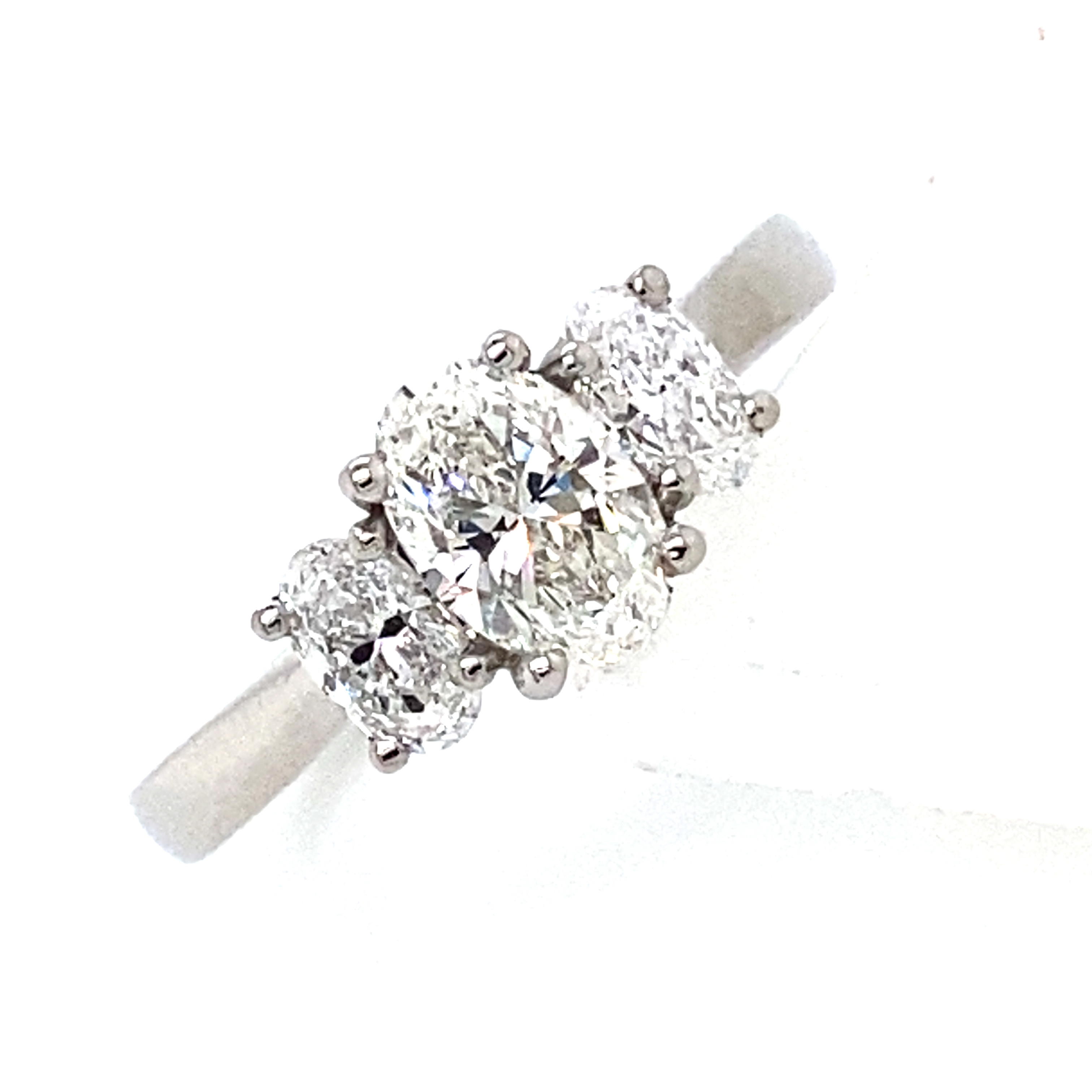 A Platinum and Oval Diamond 3 Stone Ring - 1.15 Carats