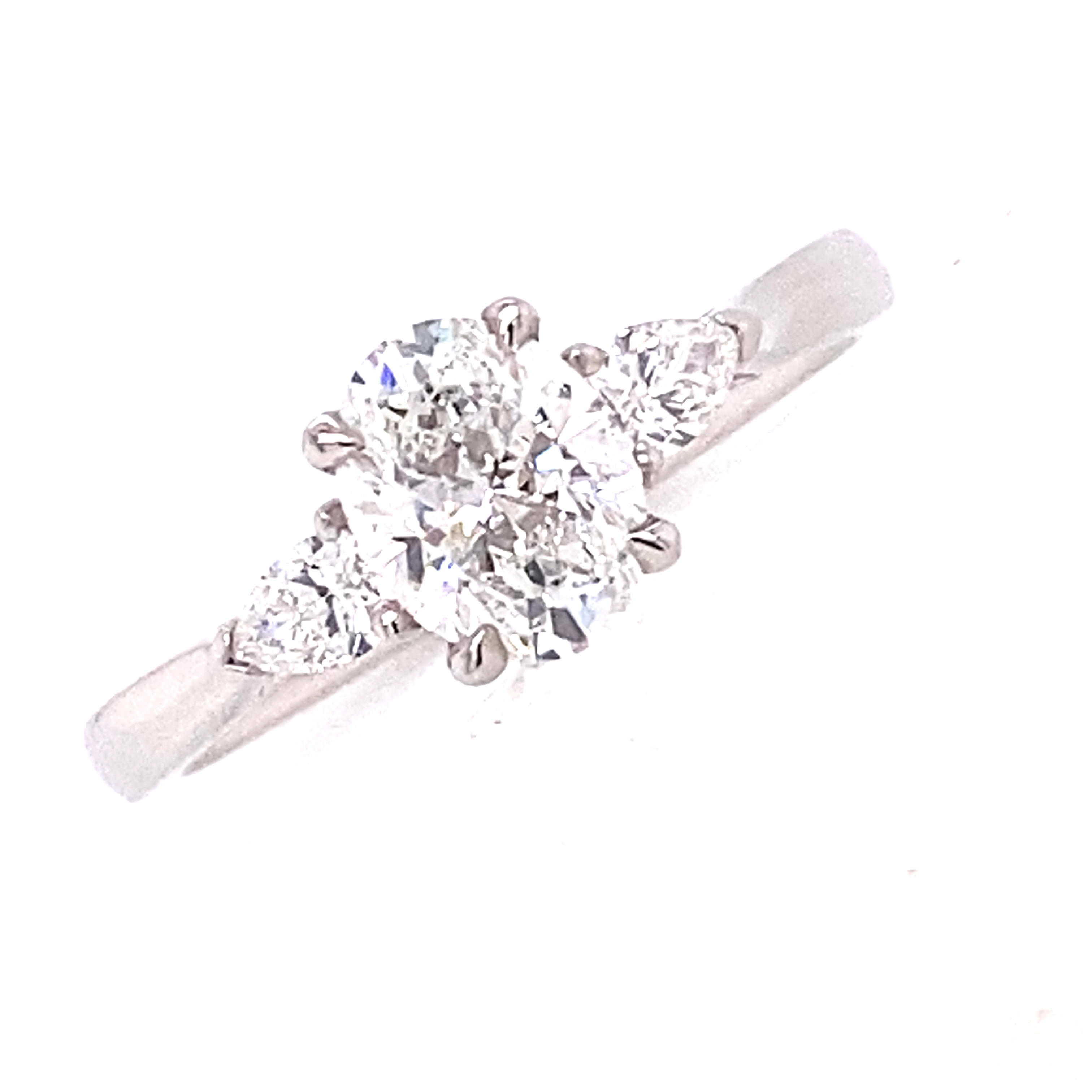 A Platinum and Diamond Ring with Ovals and Pear Shapes.