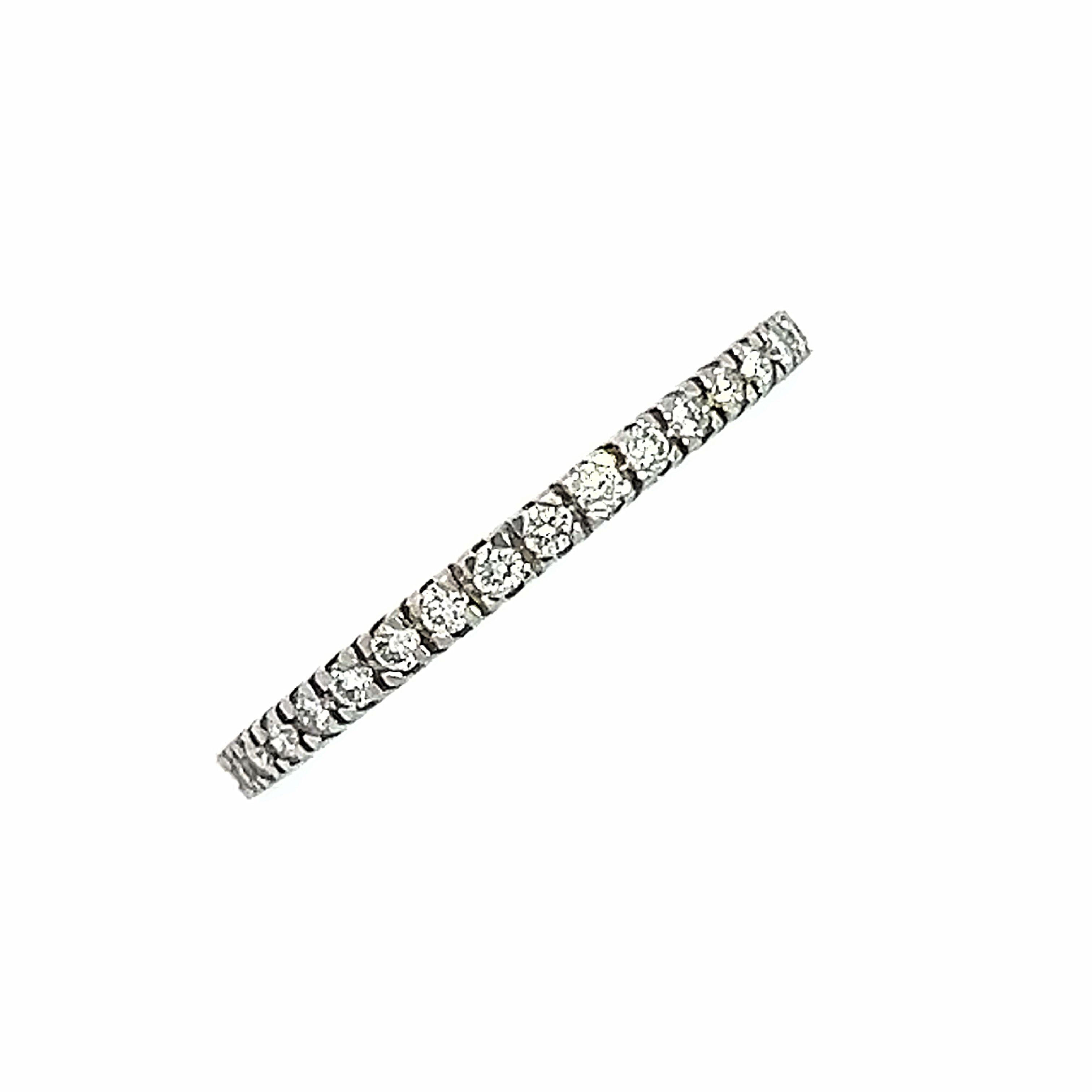 A full diamond set eternity ring in a claw setting style.