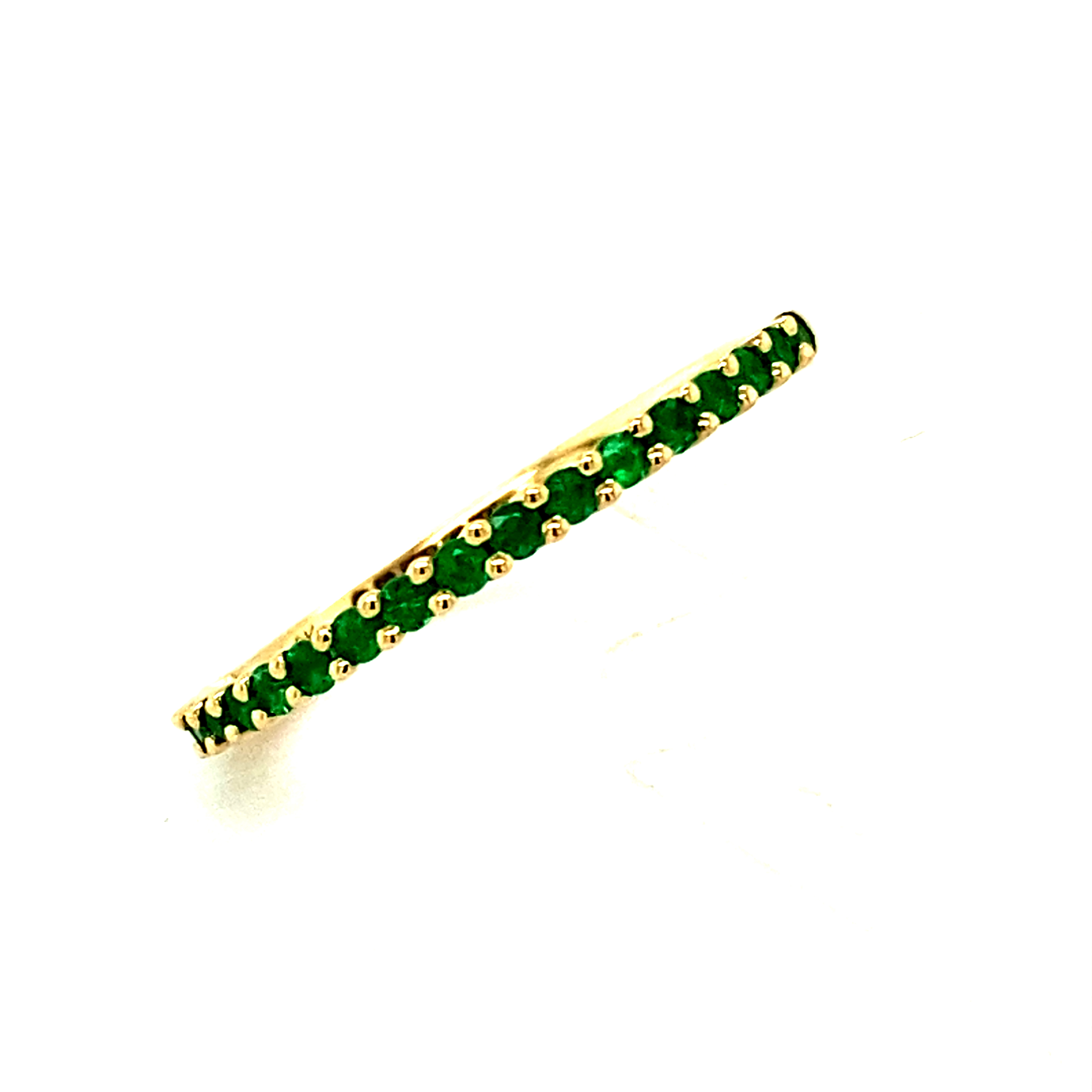 'Wave' Claw set ½ Eternity style ring with Emeralds in 9 Carat